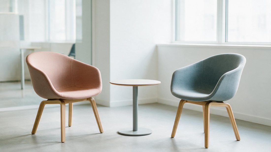 Two chairs and one small table set simply in a bright meeting corner